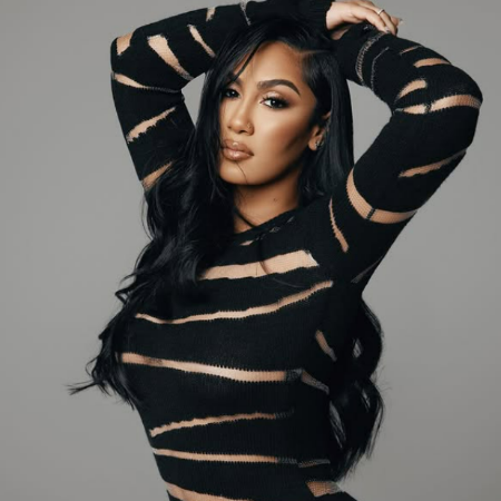 Known for her impeccable style, Queen Naija often collaborates with top brands to showcase her looks. 